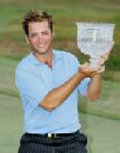 Nick Dougherty holds the 2005 Caltex Masters, presented by Carlsberg, trophy